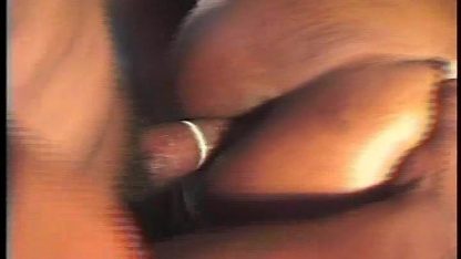 Two performers share a single large cock and swallow semen