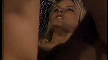 Rugged stud fucks a blonde across a desk in doggy style