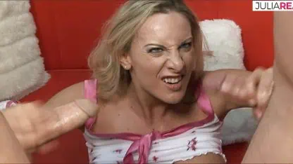 Blonde slut sucks two massive cocks to a facial cumshot