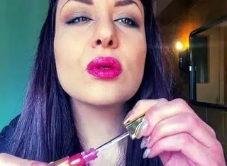 Lip Gloss and Smoke: A Close-Up on Glossy Lips