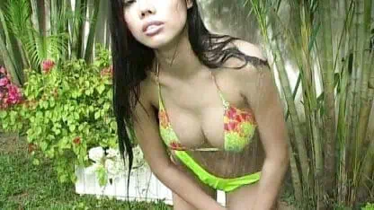 Beautiful asian girl washes her body and smokes cigarettes